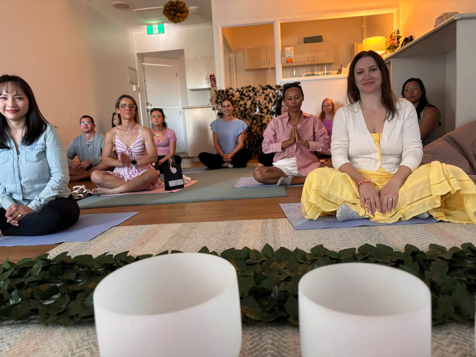 Gold-Coast-Child-Care-supporting-mothers-too Mothers enjoying a relaxing sound bath during the Mother’s Day event at Enrich Early Education, a Gold Coast child care centre supporting family wellbeing.