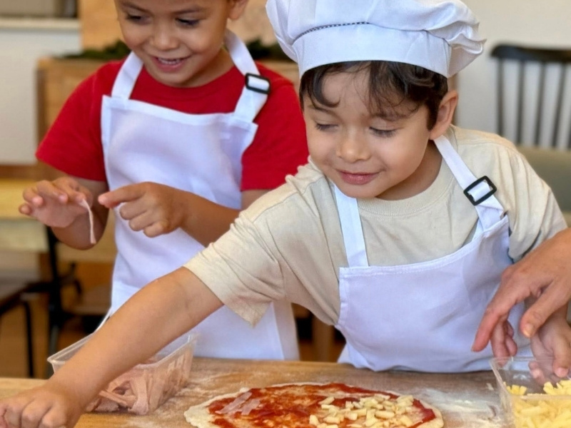 Pizza baking at Montessori child care Enrich Early Education