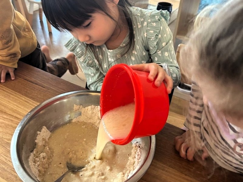 Mixing cupcakes at Enrich childcare Southport